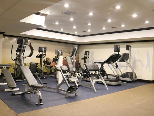 a gym with several treadmills and exercise bikes at Camino Real Antigua in Antigua Guatemala