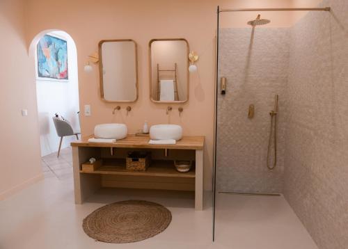 a bathroom with two sinks and a shower at La Parenthèse de Marie in Tourrettes-sur-Loup