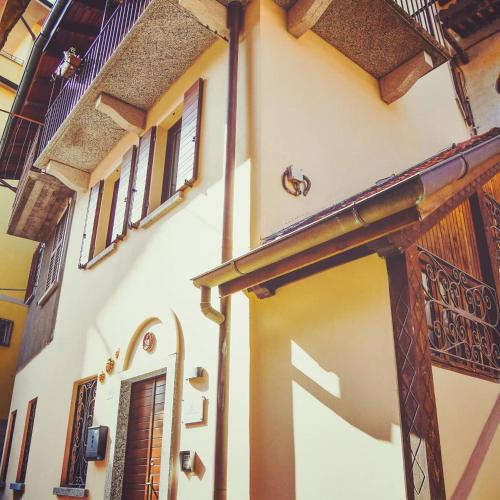 an entrance to a building with a door and windows at Vittoria Holiday House Stresa in Stresa