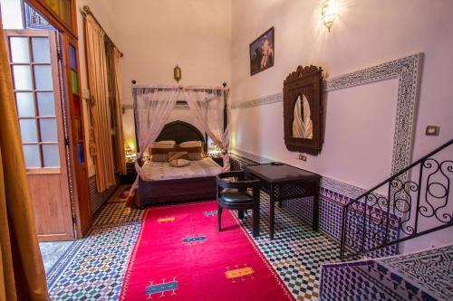 Ένα ή περισσότερα κρεβάτια σε δωμάτιο στο Riad Naila & suite