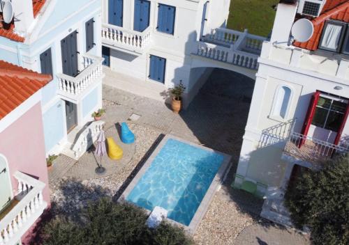an aerial view of a house with a swimming pool at Villas Thassos in Limenaria
