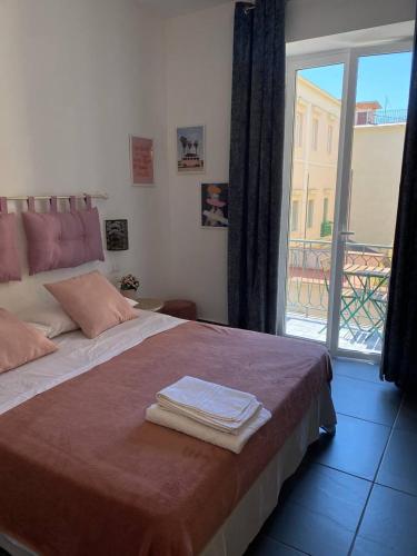 Postel nebo postele na pokoji v ubytování Le stanze dei desideri