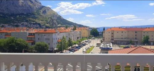 a view of a city with buildings and a parking lot at Apartmani ANITA in Omiš