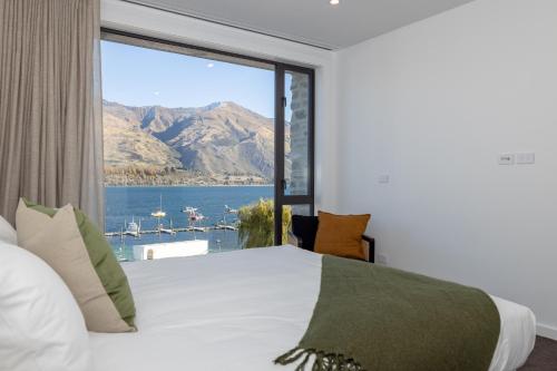 Voodi või voodid majutusasutuse Spinnaker Apartment 5 - Christchurch Holiday Homes toas