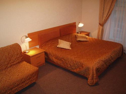 Ein Bett oder Betten in einem Zimmer der Unterkunft Nevsky Guest House