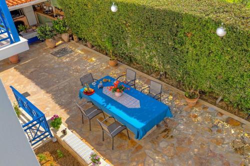 an overhead view of a table and chairs on a patio at Olive Nest, Cozy Apartment in Ammoudara in Ayía Marína