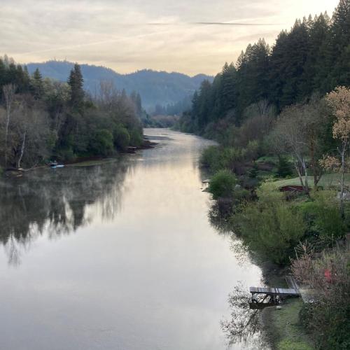 a view of a river with a boat in it at The Stavrand in Guerneville