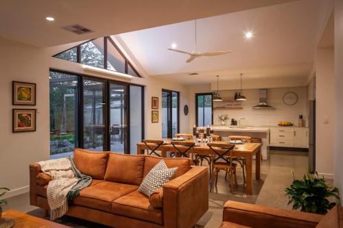 a living room with a couch and a table at Basedow Haus in Tanunda