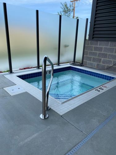 a swimming pool with a hand rail in a house at salish Inn in Anacortes