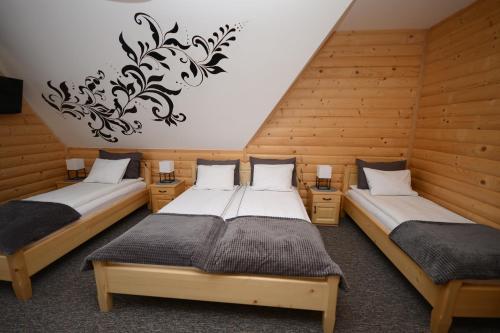Ένα ή περισσότερα κρεβάτια σε δωμάτιο στο uDany