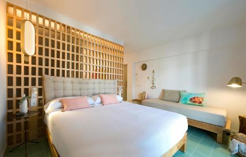 a bedroom with two beds in a room at Hostal Boutique Cana Rita in San Antonio