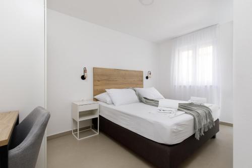 Postel nebo postele na pokoji v ubytování Residence Visković