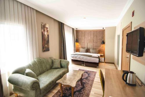 Nova Suite Residence tesisinde bir televizyon ve/veya eğlence merkezi