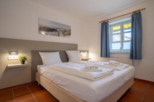 Ein Bett oder Betten in einem Zimmer der Unterkunft Komfort Appartement mit 1 Schlafzimmer A14