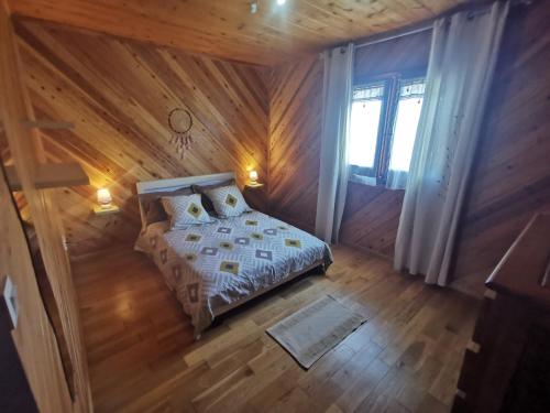 Кровать или кровати в номере Ti Kazenboi