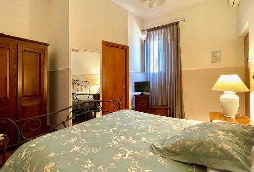 Ένα ή περισσότερα κρεβάτια σε δωμάτιο στο Affittacamere Casa di Elide