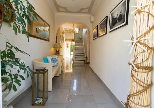 a hallway of a home with white walls and a staircase at Bursztynowa Przy Morzu - 1 minuta do plaży in Ustronie Morskie