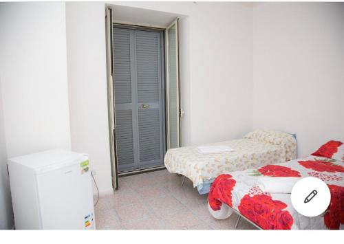 Ένα ή περισσότερα κρεβάτια σε δωμάτιο στο Camera Greta