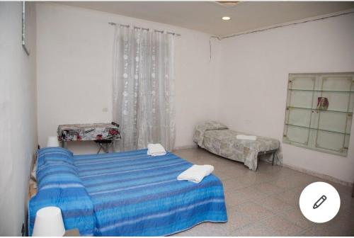 Ένα ή περισσότερα κρεβάτια σε δωμάτιο στο Camera Greta