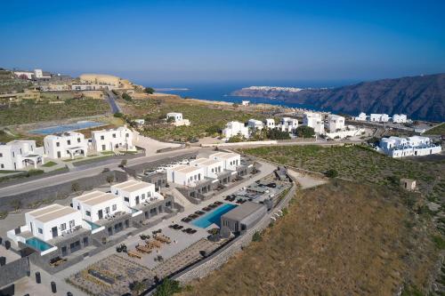 an aerial view of a resort with a pool at SantAnna Luxury Suites in Imerovigli