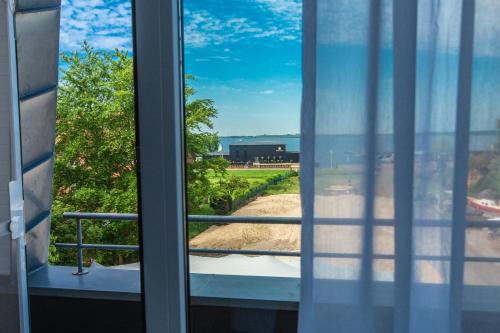 a view from a window of a building at Stratmanns Haus am See in Lembruch