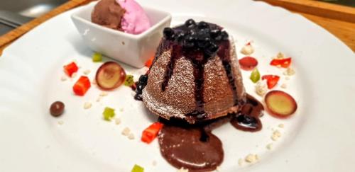 a piece of chocolate dessert on a white plate at Стаи за гости The Old House in Velingrad