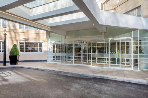 a large building with a lot of glass doors at Meliá White House Hotel Apartments in London