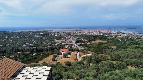 an aerial view of a city with houses and trees at Irida in Lefkada Town