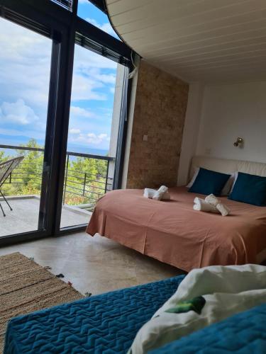 Katil atau katil-katil dalam bilik di Janis Seaview Villa