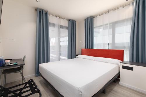 Katil atau katil-katil dalam bilik di Arena Zone Hotel