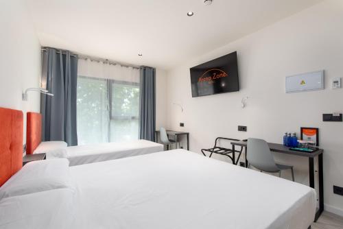 Katil atau katil-katil dalam bilik di Arena Zone Hotel