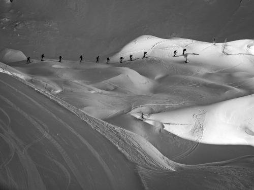 a group of people skiing down a snow covered slope at Country house Dovje in Dovje