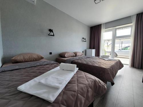 Postel nebo postele na pokoji v ubytování VIP HOTEL ZATOKA