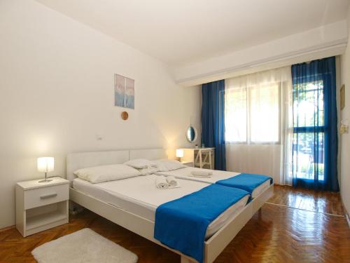 Posteľ alebo postele v izbe v ubytovaní Apartments Tomislav 2078