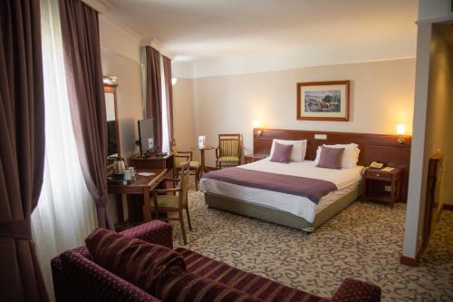 Lova arba lovos apgyvendinimo įstaigoje Dila Hotel