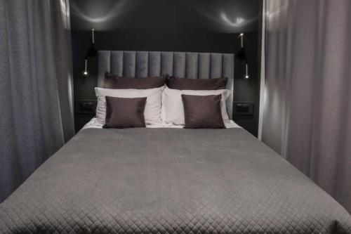 Ein Bett oder Betten in einem Zimmer der Unterkunft Apartament 4th Floor