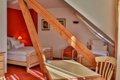 Postel nebo postele na pokoji v ubytování Hotel Saint-Hubert