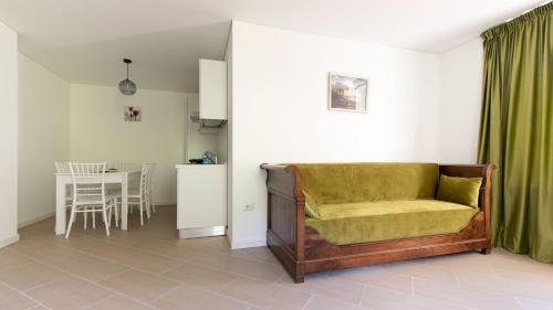 a living room with a couch and a table at Italianway - Villa Tola in Valdisotto