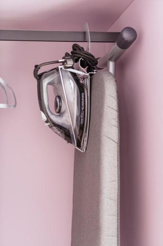 a chrome curtain rod with a shower curtain at Aqua Your Stay in Sasino