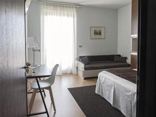 Postel nebo postele na pokoji v ubytování Hotel Funivia