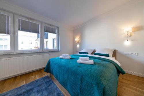 Posteľ alebo postele v izbe v ubytovaní Apartament Nowy Świat Centrum