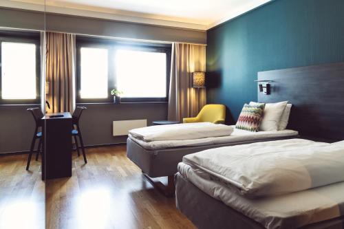 Ένα ή περισσότερα κρεβάτια σε δωμάτιο στο Easy Stay Haugesund