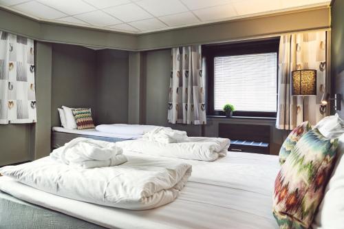 Ένα ή περισσότερα κρεβάτια σε δωμάτιο στο Easy Stay Haugesund