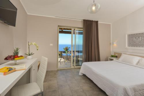 Säng eller sängar i ett rum på Castelsardo Resort Village