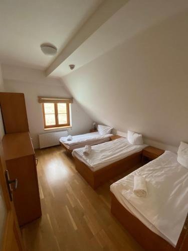 Postel nebo postele na pokoji v ubytování Chata Sport