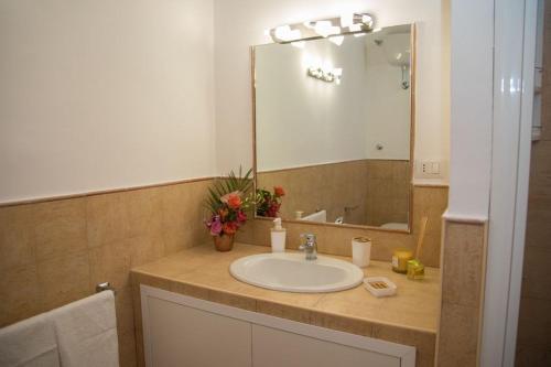 a bathroom with a sink and a mirror at Rome center apt in Rome
