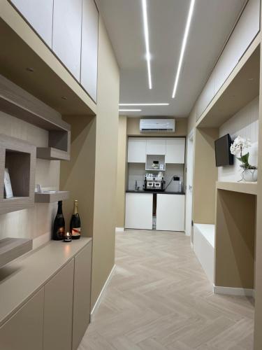 a hallway with a kitchen and a living room at B&B L'Orchidea in Tropea