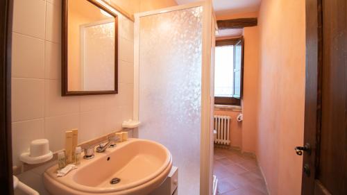 a bathroom with a sink and a mirror at Borgo Majella by Rentbeat in Abbateggio