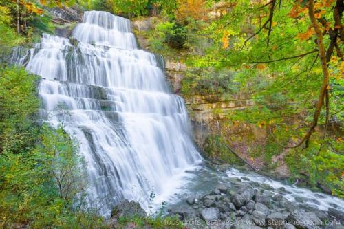 a waterfall in the middle of a forest at Chez la Tante Louise - appartement privé de charme in Passenans