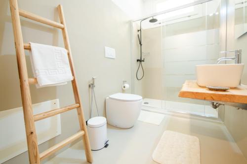a bathroom with a shower and a toilet and a sink at Tenuta Don Carmelo in Lecce